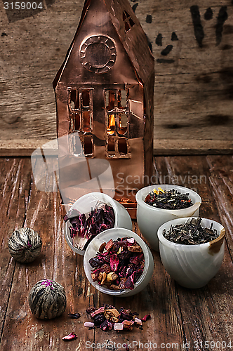 Image of tea leaves on the background of the house foil 