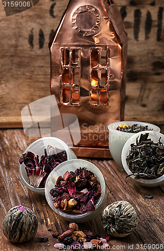 Image of tea leaves on the background of the house foil 