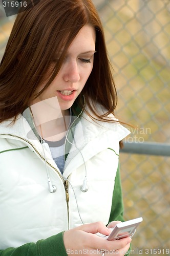 Image of Girl checking phone