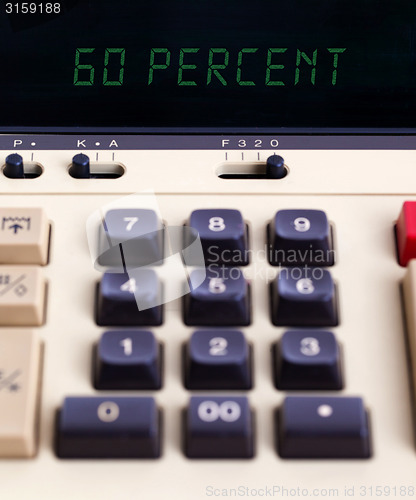 Image of Old calculator showing a percentage - 60 percent