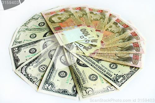 Image of dollars and grivnas banknotes isolated