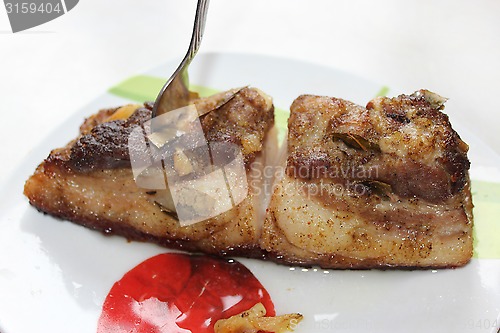 Image of baked piece of meat on the plate