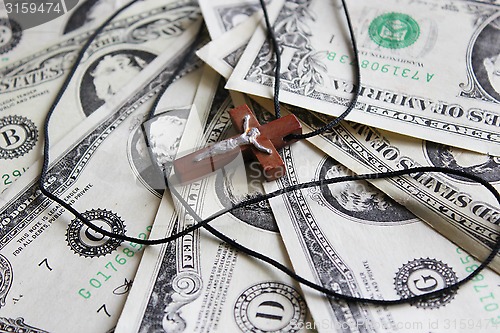 Image of wooden cross on the dollar banknotes