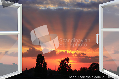 Image of window opened to the picturesque scarlet sunset