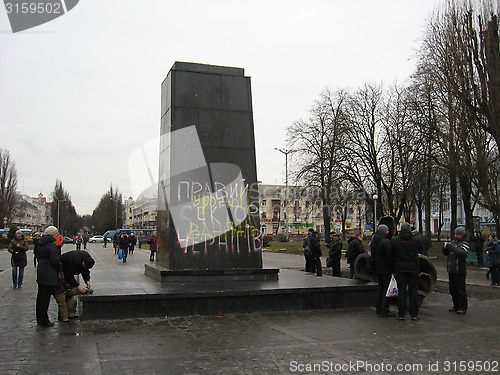 Image of thrown bronze monument to Lenin in winter 22, 2014