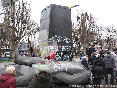 Image of thrown bronze monument to Lenin in winter 22, 2014