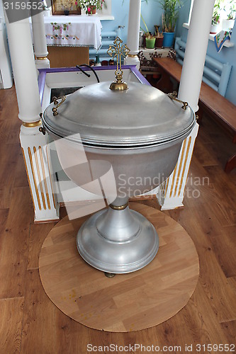 Image of Beautiful Baptismal font using during christening