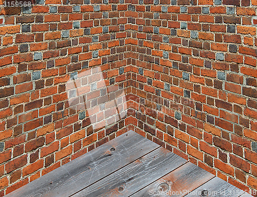 Image of corner in the room with walls from the red brick