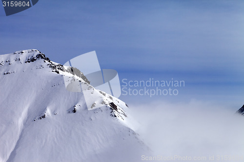 Image of Snowy rocks in fog