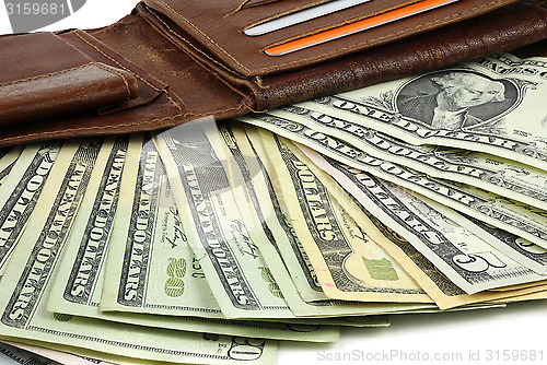 Image of Leather wallet full of Dollar banknotes