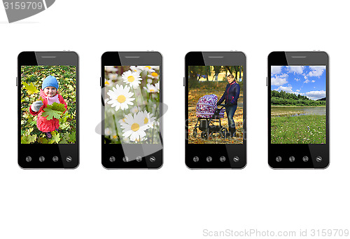 Image of four smart-phones with colored images isolated