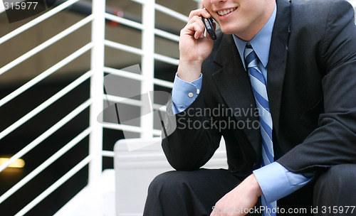 Image of Businessman talking on cell