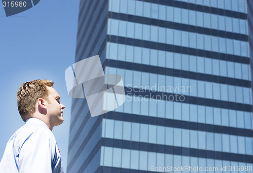 Image of Businessman standing alone