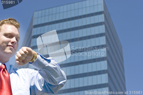 Image of Businessman checking time