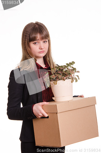 Image of Portrait of a girl with box fired and flower in hands