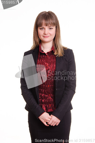 Image of Portrait of a confident woman in jacket with folded hands