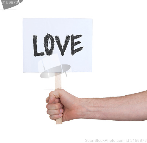 Image of Hand holding sign, isolated on white