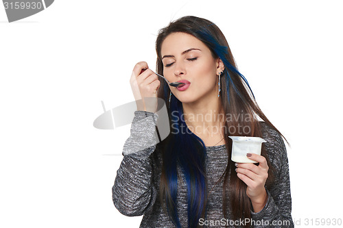 Image of Healthy woman eating yoghurt