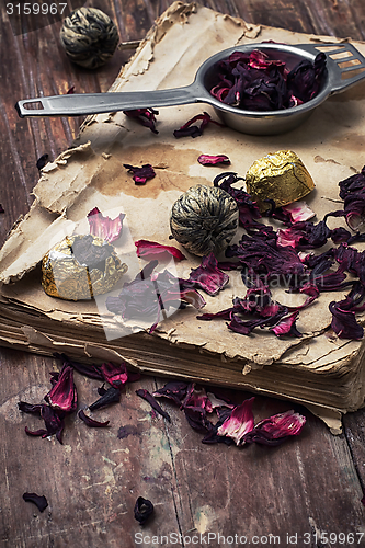 Image of old book is strewn with the tea leaves