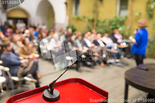 Image of Female speaker at Business Conference.