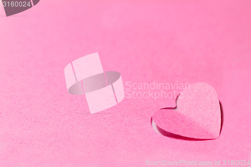Image of Pink paper hearts and pink background