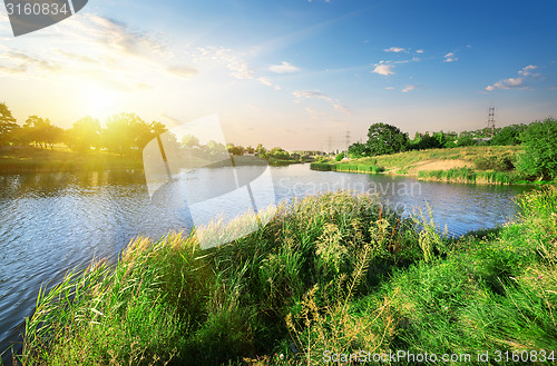 Image of Bright sunset over river