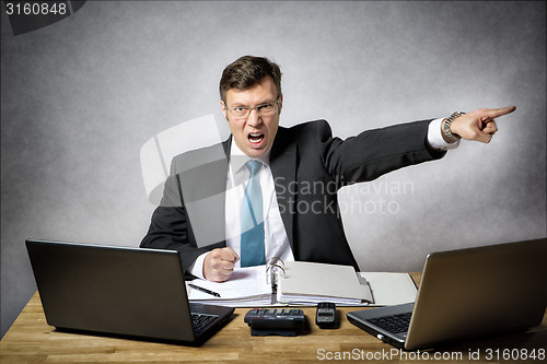 Image of Angry business man in office