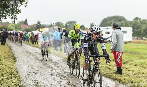 Image of The Cyclist Michal Golas on a Cobbled Road - Tour de France 2014