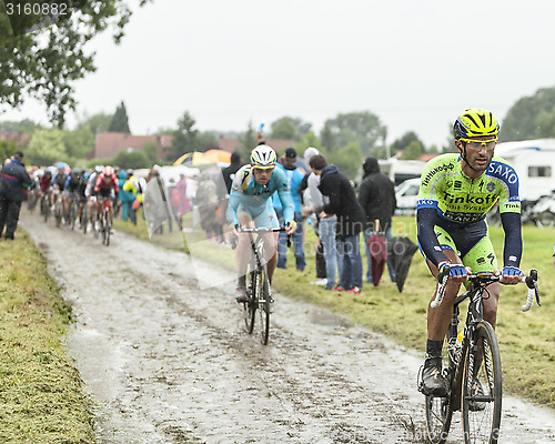 Image of The Cyclist Daniele Bennati on a Cobbled Road - Tour de France 2