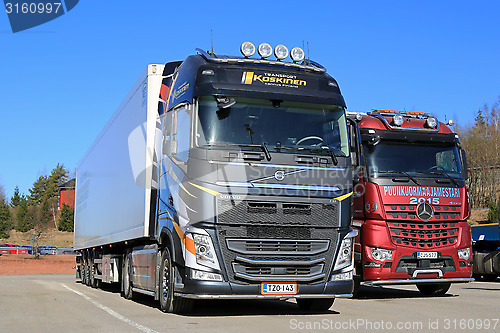 Image of New Volvo FH 500 Semi and Mercedes-Benz Arocs Logging Trucks