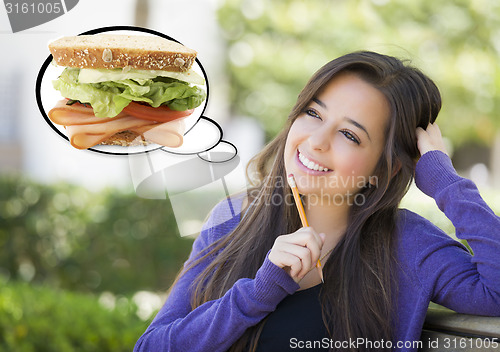 Image of Pensive Woman with Big Sandwich Inside Thought Bubble
