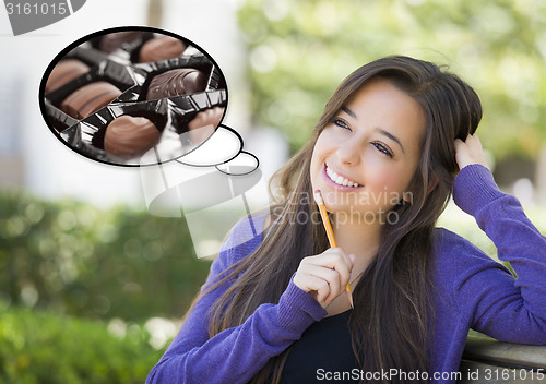 Image of Pensive Woman with Chocolate Candy Inside Thought Bubble