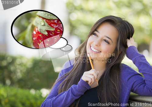 Image of Pensive Woman with Strawberry Inside Thought Bubble