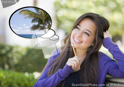 Image of Pensive Woman with Tropical Scene Inside Thought Bubble