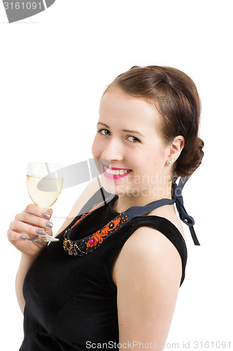 Image of beautiful young brunette woman holding a glass of white wine