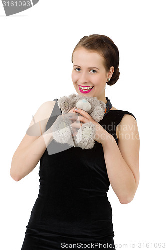 Image of attractive smiling brunette holding teddy bear