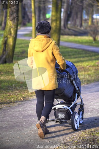 Image of Young mother with  pram 