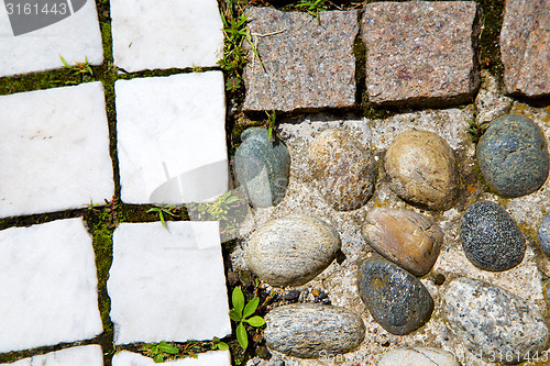 Image of wall milan  in italy old   church grass background  stone