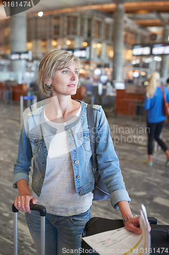 Image of Woman with backpack going on boarding
