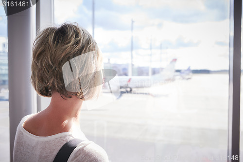 Image of Woman at the airport window 