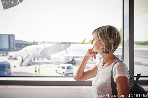 Image of Woman at the airport window 