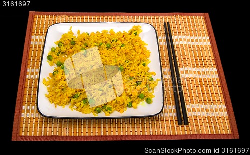 Image of Rice with vegetables and chopsticks on bamboo mat