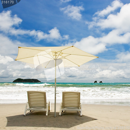 Image of Two Chairs at the Beach