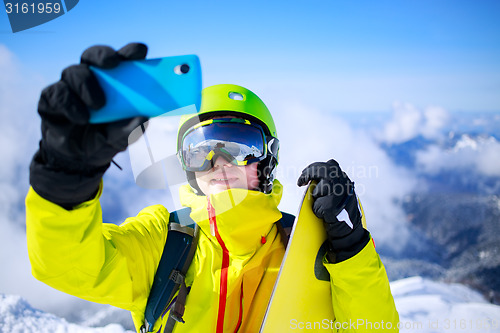 Image of Man in winter clothes taking a selfie