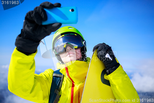 Image of Man in winter clothes taking a selfie