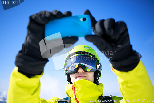 Image of Man in winter clothes taking a selfie