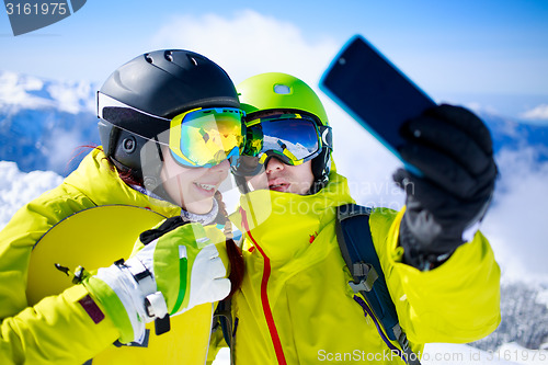 Image of Young couple taking a selfie