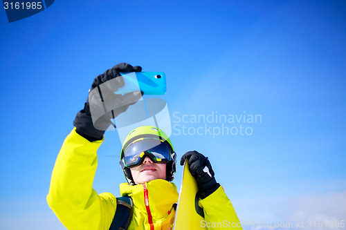 Image of Man in winter clothes taking a selfie