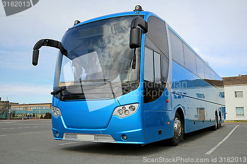 Image of Blue Bus Waits for Passengers