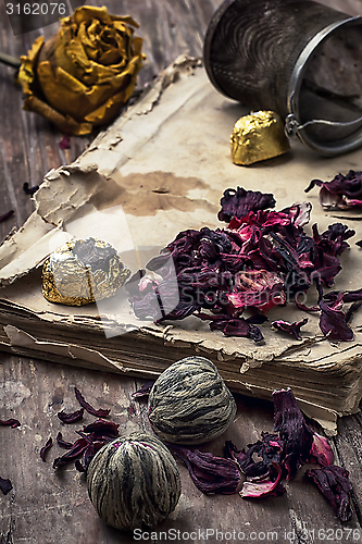 Image of old book is strewn with the tea leaves